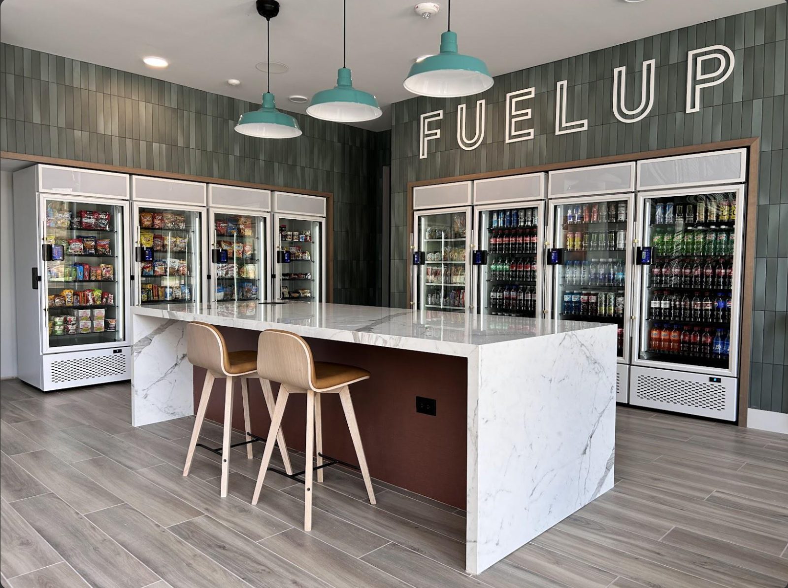 Premium micro-market with marble island, bar stools, and multiple coolers